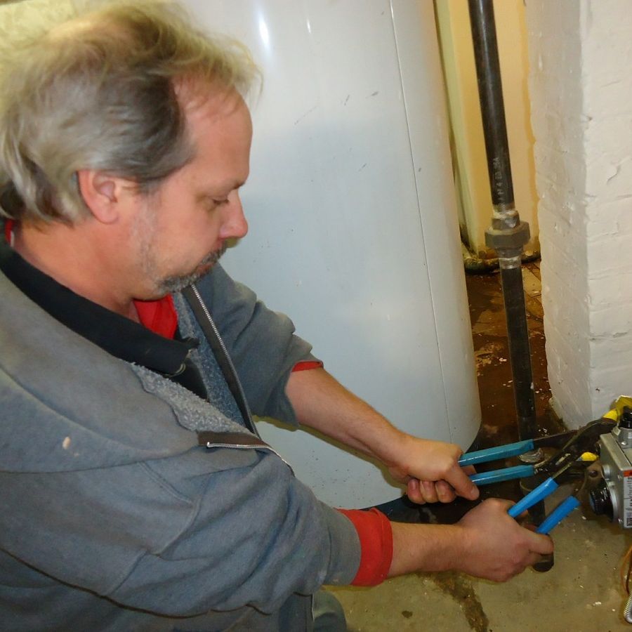 Plumber repairing pipes