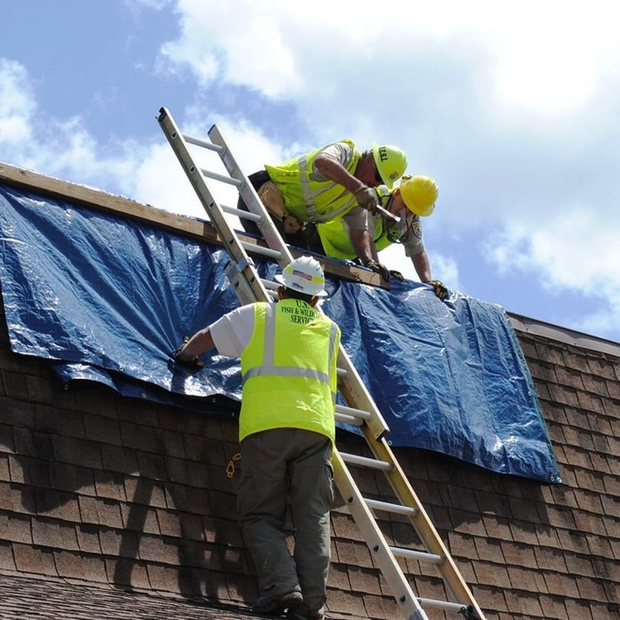 Roofers working on a roof